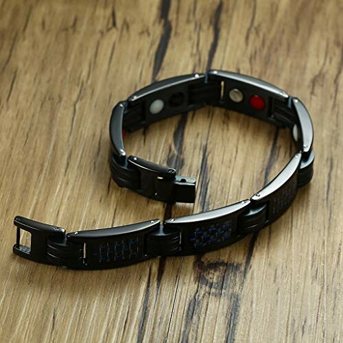 Svart magnetarmband för terapi på träbord