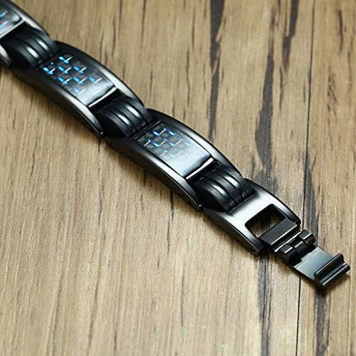 Svart magnetarmband på träbord